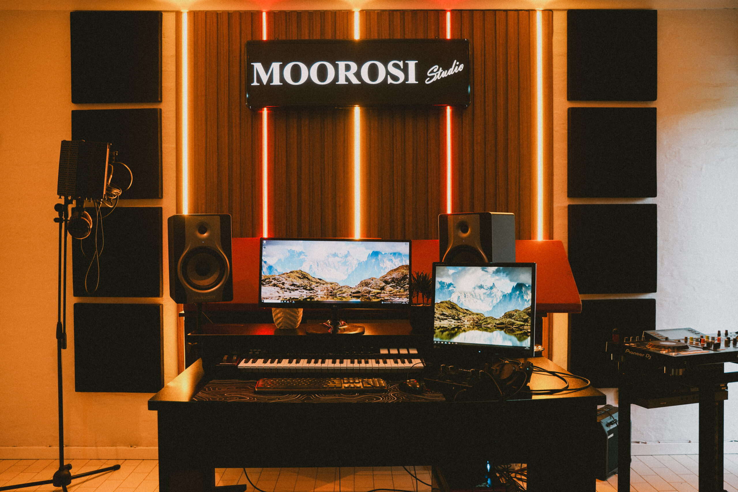 Sunlit Durban home music studio desk with turntable, monitor speakers, and timber acoustic panels